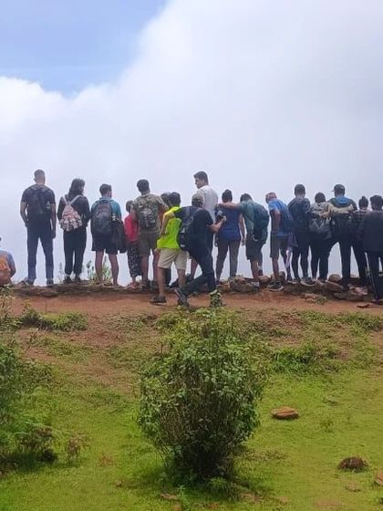 The group gathered at a viewpoint, looking out at the valley below.