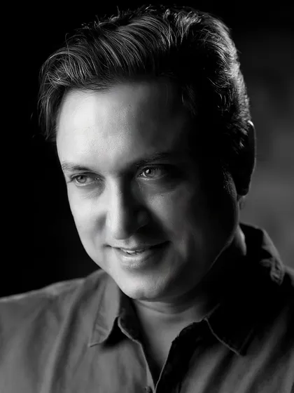 A classic black and white portrait of veteran actor Sanjev Sharma. Monochrome photography strips away distractions, focusing entirely on expression and character.