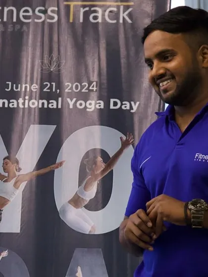 Me, standing by our International Yoga Day banner. I believe yoga is the fountain of youth.