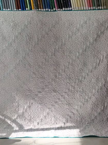 The simple dotted backing fabric for the diagonal star quilt.