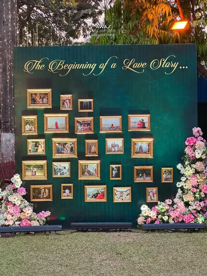 A wider view of the "Love Story" memory wall, showing its placement within the event space.