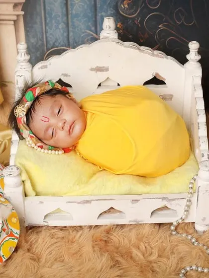 For families wanting to honor tradition, I offer special themed shoots like this 'Little Krishna' setup. We create a divine and beautiful scene to celebrate your little one in a culturally rich and memorable way.