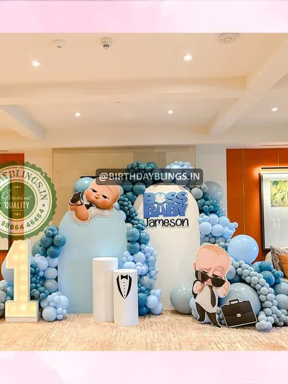 A Boss Baby first birthday party, perfect for a little one who's "the boss". The blue and grey balloon decor, character cutouts, and a light-up number '1' create a fun and corporate-cute theme.