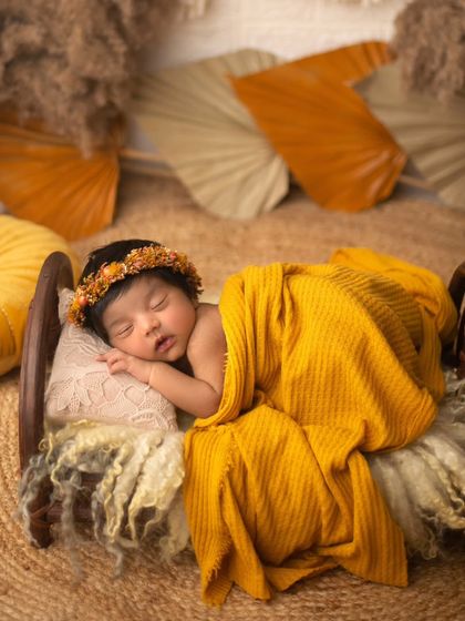 This boho-chic setup features a tiny bed, a jute rug, and warm, earthy tones. I can style prop setups to match any aesthetic you love.