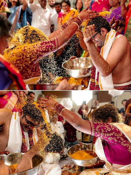 The 'Talambralu' ritual in a South Indian wedding, where the couple showers each other with rice and turmeric. A moment of immense joy and blessing.