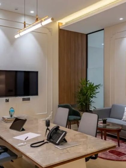 This cabin is designed for both individual work and small team meetings. The main desk is large enough for collaboration, and a separate sofa area provides a more relaxed setting for discussions.