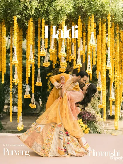 Therein bloomed a love as bright as the marigolds surrounding them. The Haldi ceremony is a celebration of pure joy, and I focus on capturing the candid laughter and playful romance that make these pre-wedding rituals unforgettable. This portrait showcases the vibrant energy and tradition of a classic Haldi celebration.