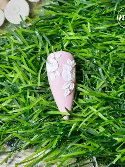 Elegant 3D floral art on a matte pink base. This student work shows a great understanding of texture and dimension.