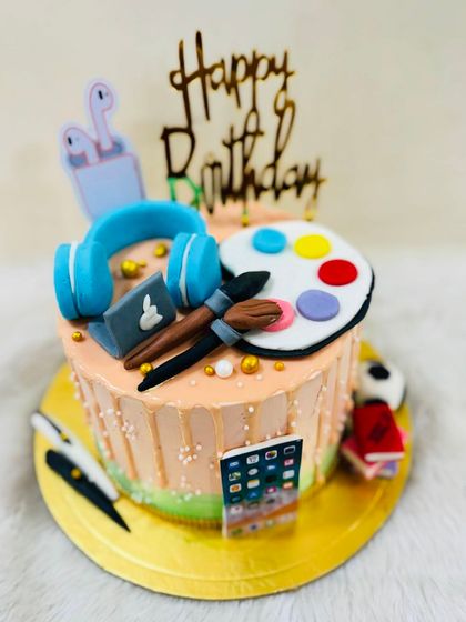 A full view of the cake celebrating all things creative and digital.