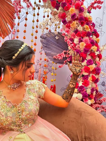 An elegant pose from the bride, showcasing the detailed armband and hand design.