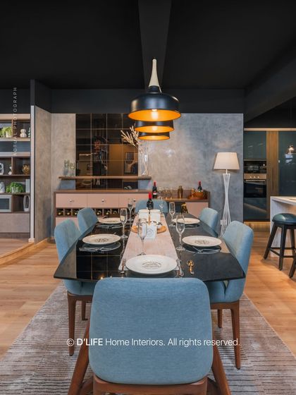 A long view of the dining space, highlighting the dark ceiling and moody lighting that create an intimate and luxurious feel, perfect for entertaining.