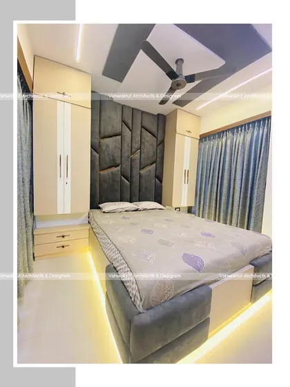 This master bedroom features a full-height geometric headboard that becomes the room's focal point. We also included storage cabinets on both sides of the bed to maximize functionality without compromising on style.