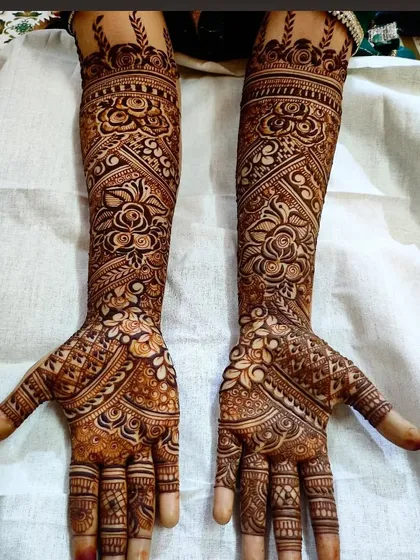 A classic bridal design with a beautiful blend of roses and traditional Indian motifs.