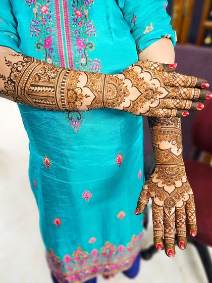 A creative pose showing both the front and back of the hands in this dome-inspired bridal set.