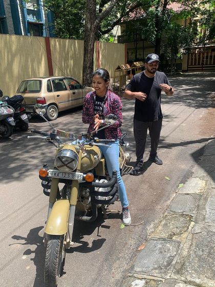 The joy of learning. This graduate's smile is infectious as she masters a new skill during her training.