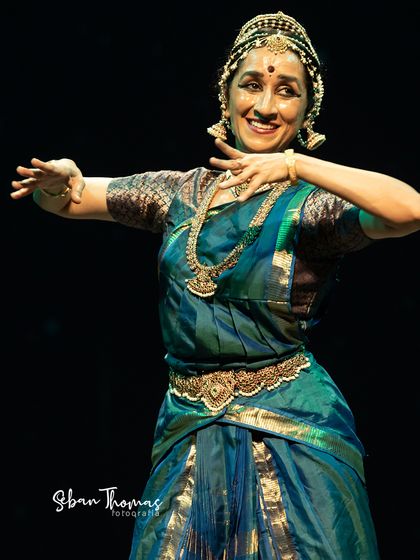 The connection with the audience is everything. In this moment, I share the character's delight, breaking the fourth wall with a joyful expression.