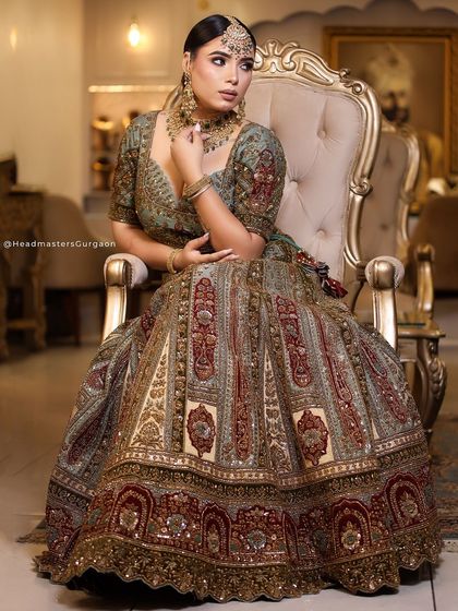 A full-length portrait of the bride in her magnificent lehenga. My goal is to create a complete look where the makeup, hair, and outfit work in perfect harmony.