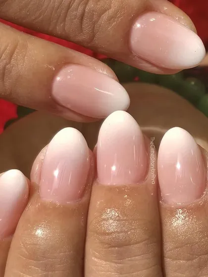 The timeless beauty of a classic baby boomer ombré set. These nails feature a seamless blend from a soft pink base to a clean white tip, creating an effortlessly chic and polished look.