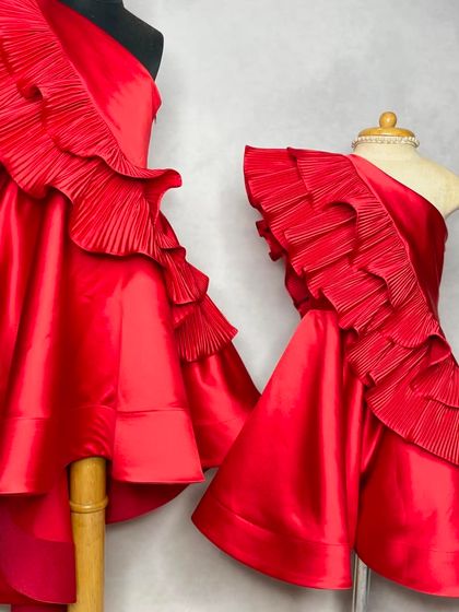 For the girl who loves bold color. Our "Desire" dress in a stunning, vibrant red, shown here in both mom and daughter sizes for a powerful twinning statement.