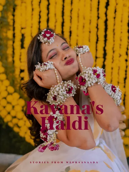 A beautiful portrait of a bride from her Haldi ceremony, playfully showing off her floral jewelry.