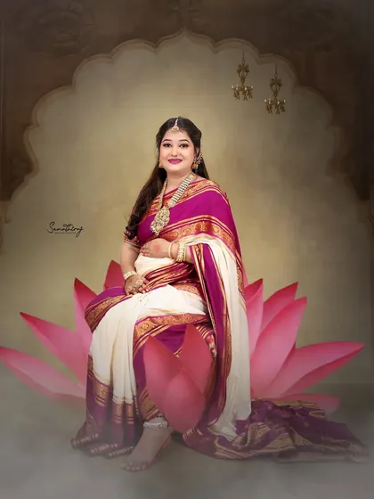 Channeling the goddess Lakshmi, this mother-to-be is seated on a lotus flower, draped in a traditional saree. This divine concept is a powerful way to celebrate the life-giving energy of motherhood.