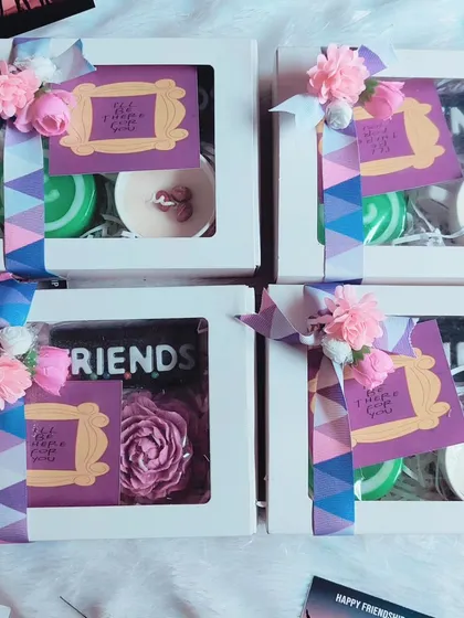 A collection of Friendship Day gift boxes, each with a "Friends" theme and other custom soaps and candles.