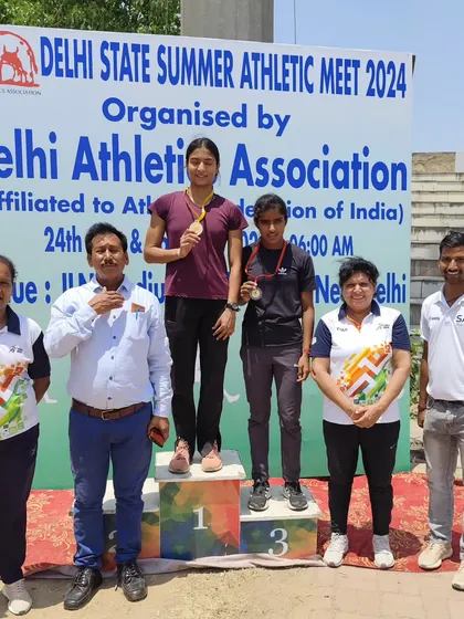 A proud moment for me, standing with my athlete on the podium at the Delhi State Summer Athletic Meet 2024. Seeing my students win is the biggest reward for a coach.