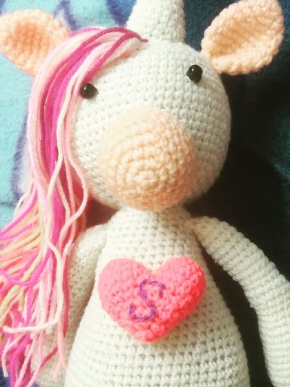 This is Lee the unicorn, personalized with a heart and initial for a very special little human. Custom details like this make a handmade gift even more meaningful.