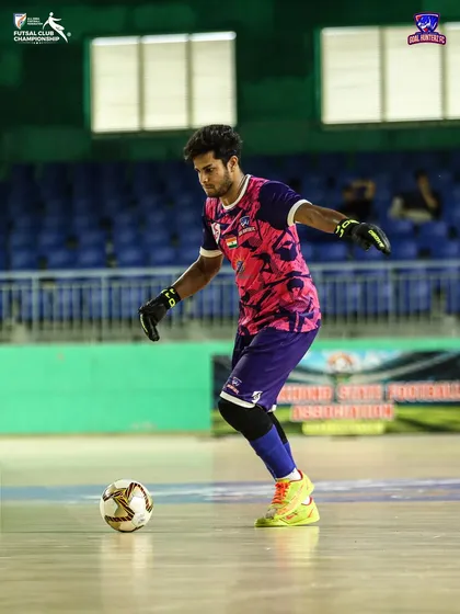 Our goalkeeper in his vibrant kit, ready for action.