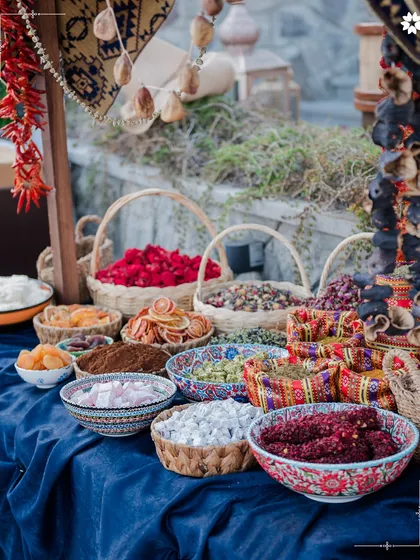 A market style display of local Turkish spices, dried fruits, and sweets. We love incorporating local culture and flavours into our destination wedding menus, offering guests an authentic taste of the region.