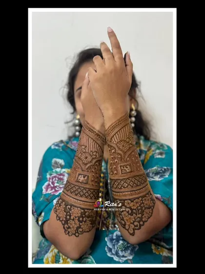 The bride showing off her beautiful back-of-arm designs.