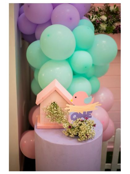 A duplicate image of the cute birdhouse and 'ONE' sign detail.