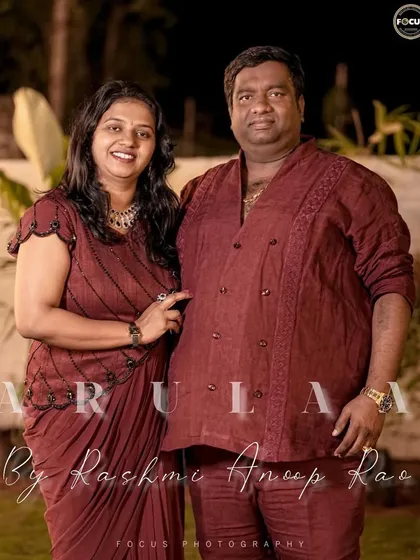 There's something so special about dressing the entire family. For this event, we created coordinated linen outfits, including a double-breasted Henley shirt for him and a dhoti-style gown for her, telling their story together.
