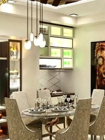 A luxurious dining area with a marble-top table and a statement Buddha artwork. The custom crockery unit with internal lighting showcases our attention to detail in creating bespoke furniture.