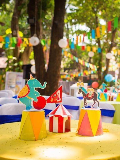 A vintage circus centerpiece for a carnival-themed first birthday. These small details on each table help carry the theme throughout the entire event space.