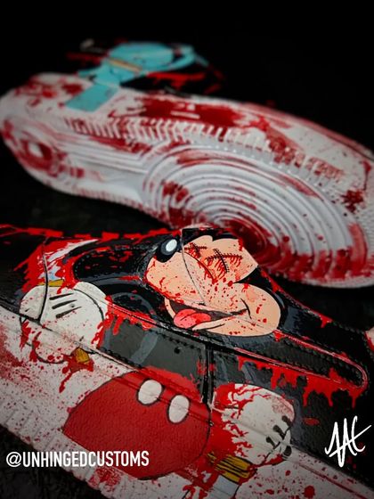 This is what happens when cartoon characters go unhinged. A gory, blood-splattered Mickey Mouse on a custom Air Force 1 with a replaceable swoosh.