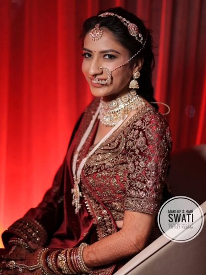 Our bride Priya, looking regal in a deep maroon velvet lehenga. My artist Swati created a classic North Indian bridal look for her.