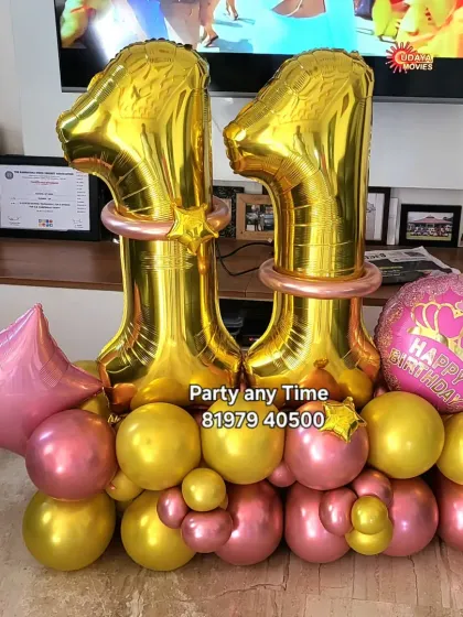 An 11th birthday number bouquet in pink and gold.