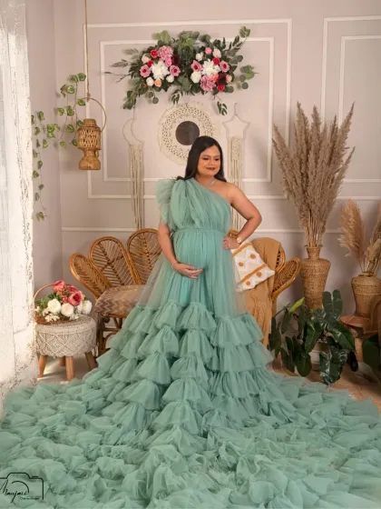 A confident and radiant pose. This mama-to-be owns the frame, looking like a true goddess in the earthy and elegant boho setup.