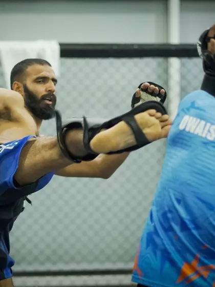 A fighter throws a high kick during a sparring round. The dynamic and explosive nature of our athletes is a result of a comprehensive strength and conditioning program.