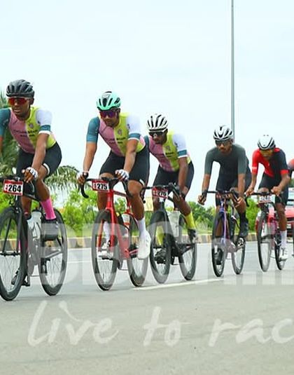 A long, organized paceline shows the discipline of the peloton. Drafting efficiently is key to conserving energy for the 161 km distance.
