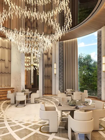 Another view of the Alibaug clubhouse banquet hall, where floors of pristine white marble with exquisite inlay patterns narrate a tale of opulence. The space is designed for grand celebrations and is a statement of lavish living.