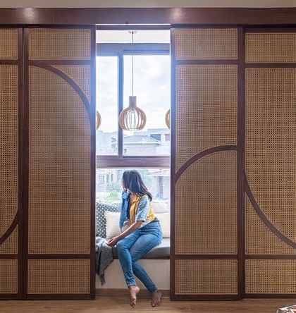 The cane screens can be partially opened to control the amount of light and privacy. This feature allows the user to customize the atmosphere of their reading nook throughout the day.