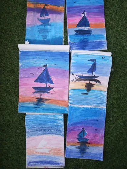 A collection of sunset and boat paintings by my students. They did a great job capturing the reflection of the sky on the water.