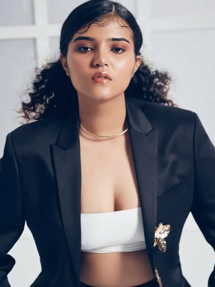 This image showcases a confident and fresh-faced look. The focus is on luminous skin and lightly defined features, demonstrating a clean makeup style that is highly sought after for commercial and advertising work.