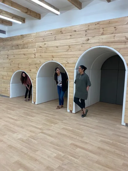 A candid moment of fun and teamwork on site. This photo captures the spirit of our team as they interact with the playful architectural elements of a project, showcasing that for us, design is not just practiced, it's lived and enjoyed.