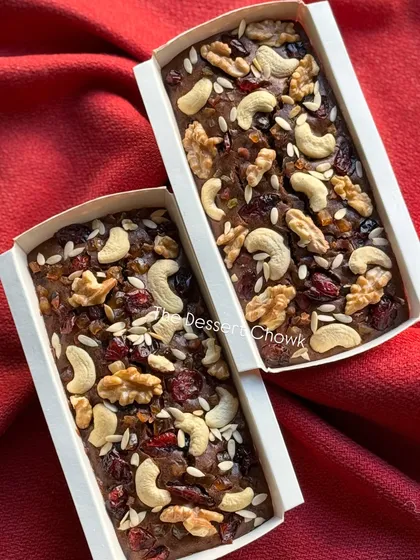 Two of my plum cakes side-by-side, showing the consistent quality and generous toppings on each one.