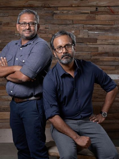 A portrait of the principal architects, Jibu John and Thomas, whose design philosophy is rooted in responding to climate and client aspirations.