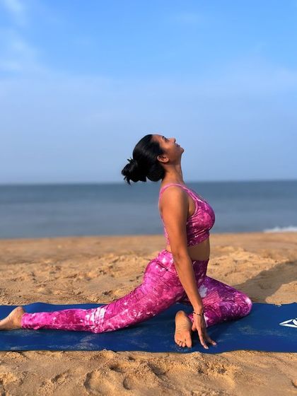 Holding Pigeon Pose on the beach allows for a deeper connection with the breath and the sound of the waves. This asana is a perfect blend of strength and serenity, opening the hips and calming the mind.