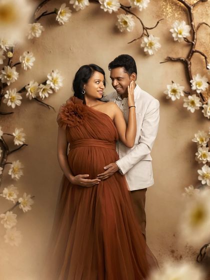 An intimate couple's portrait framed by our floral arch. The Copper gown's warm tone is perfect for romantic and timeless photos.